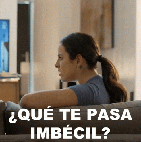 Woman Sitting On Couch Que Te Pasa Imbecil