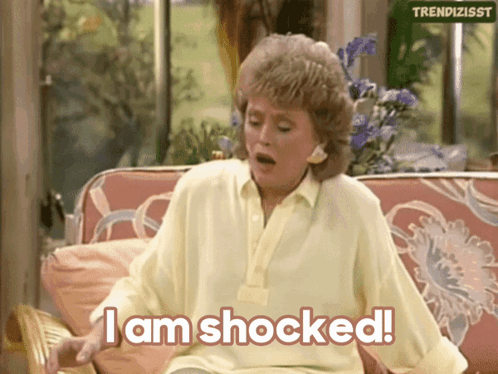 Woman Sitting on Couch Saying I Am Shocked