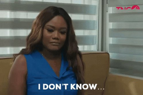 Woman Sitting on Couch Saying I Don't Know
