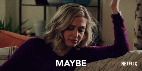 Woman Sitting on Couch Saying Maybe