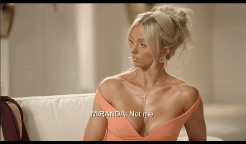 Woman Sitting on Couch Saying Miranda Not Me