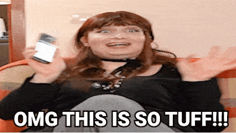 Woman Sitting On Couch Saying OMG GIF