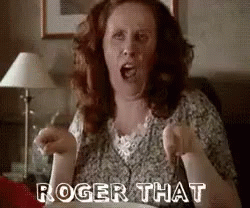 Woman Sitting on Couch Saying Roger That