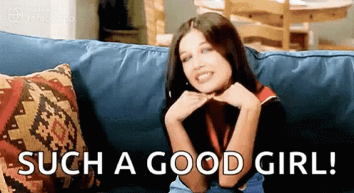 Woman Sitting on Couch Saying Such a Good Girl