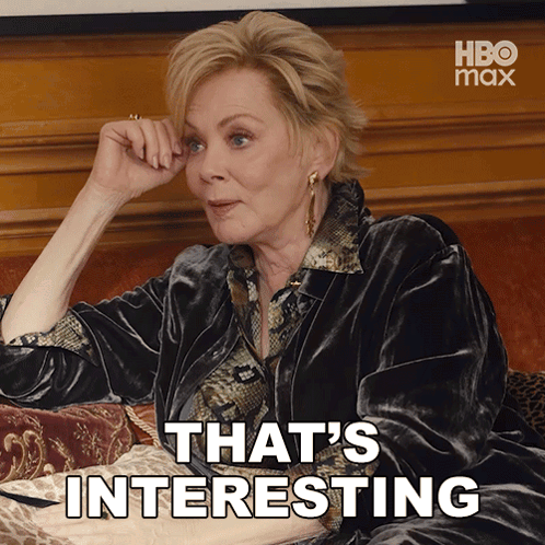 Woman Sitting On Couch Saying That's Interesting GIF
