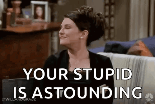 Woman Sitting On Couch Smiling Your Stupid Is Astounding GIF