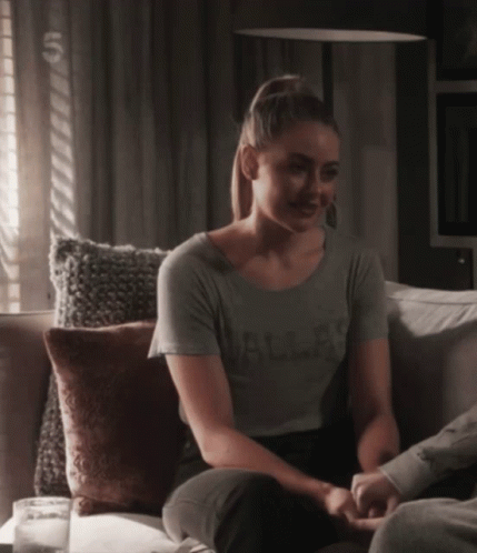 Woman Sitting on Couch Wearing Dallas Shirt
