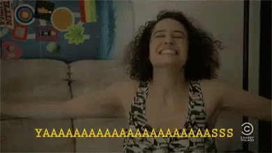 Woman Sitting on Couch with Arms Outstretched