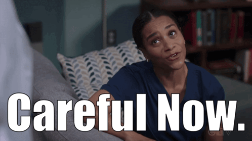 Woman Sitting On Couch With Careful Now GIF
