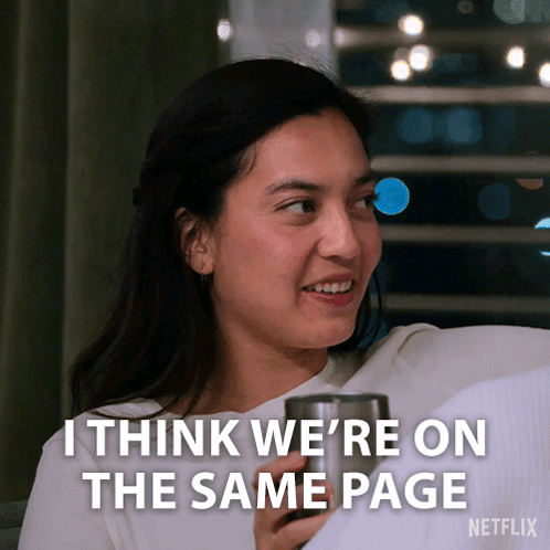 Woman Sitting On Couch With Cup And Same Page GIF