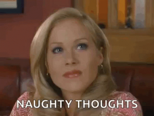 Woman Sitting on Couch With Naughty Thoughts