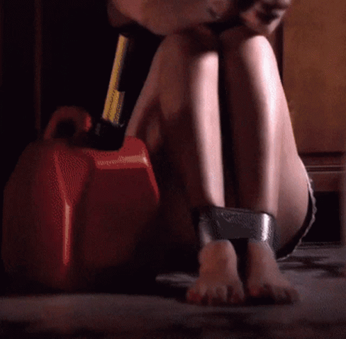 Woman Sitting on Floor With Feet Taped Together