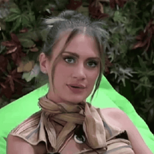 Woman Sitting on Green Bean Bag Chair