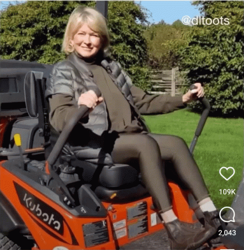 Woman Sitting on Kubota Lawn Mower