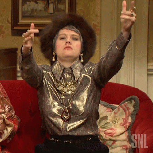 Woman Sitting on Red Couch with SNL