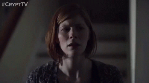 Woman Sitting On Stairs With Eyes Closed GIF