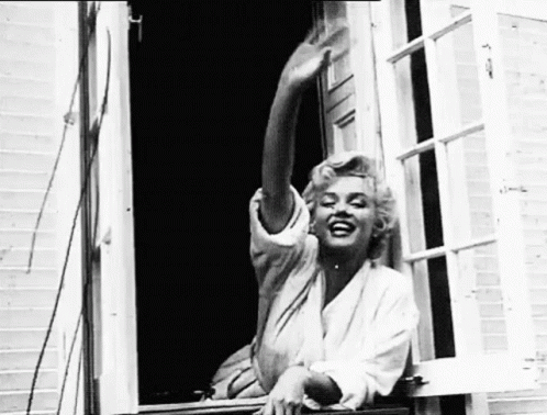 Woman Sitting on Window Sill with Outstretched Arms