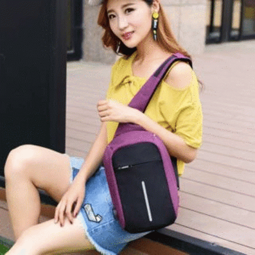 Woman Sitting on Wooden Deck Holding Purple Backpack