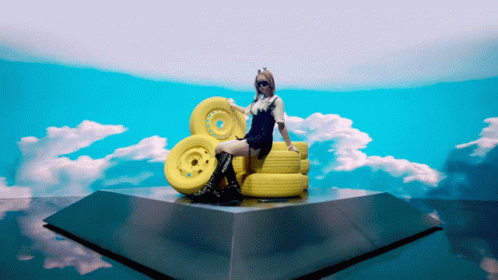 Woman Sitting on Yellow Wheels