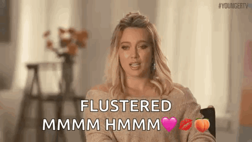 Woman Sitting Saying Flustered Mmmm Hmmm GIF