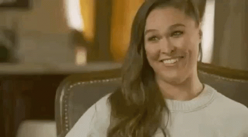 Woman Sitting Smiling