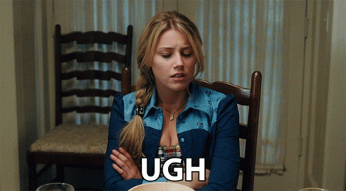 Woman Sitting With Arms Crossed Saying Ugh