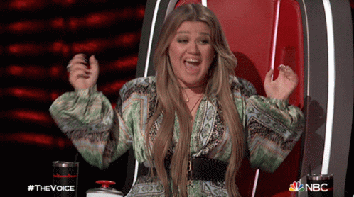 Woman Sitting With Arms Up #TheVoice