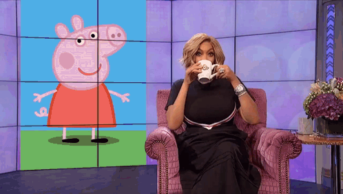 Woman Sitting With Coffee In Front Of Peppa Pig Screen GIF