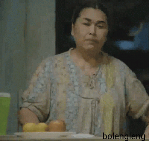 Woman Sitting With Hand On Forehead GIF
