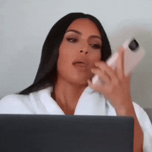 Woman Sitting With Laptop And Cell Phone GIF
