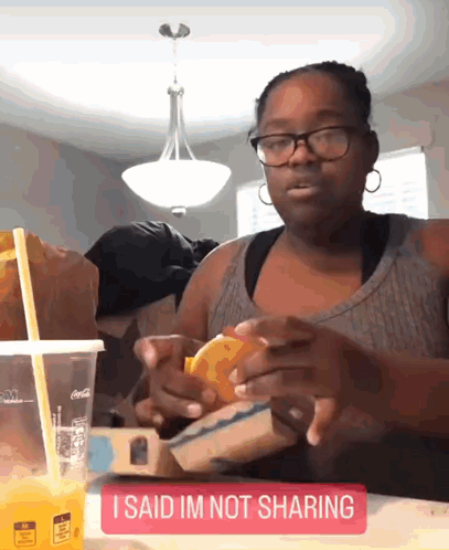 Woman Sitting with Orange Juice and I Said Im Not Sharing Sign