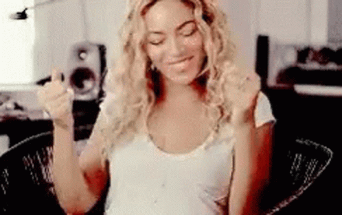 Woman Sitting with Outstretched Arms Making Funny Face