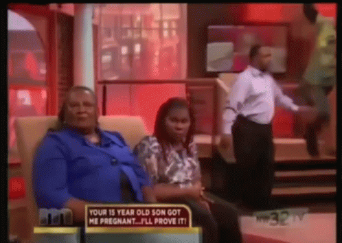 Woman Sitting with Provocative Sign