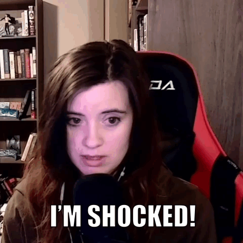 Woman Sitting with Shocked Expression