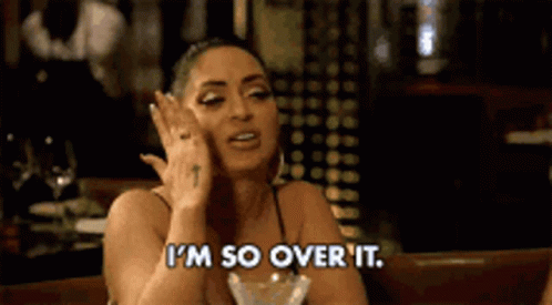 Woman Sitting With Wine Saying I'm Over It GIF