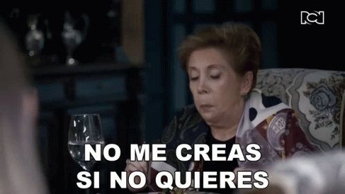 Woman Sitting With Wine Saying No Me Creas Si No Quieres