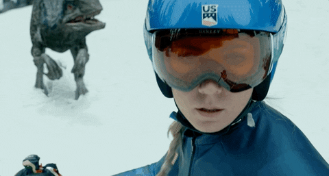 Woman Skiing Velociraptor At Back GIF