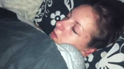 Woman Sleeping Under Blanket