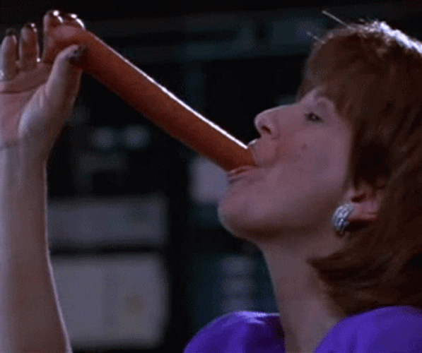 Woman Slurping Sausage  GIF