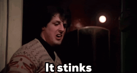 Woman Smelling in Dark Room Saying It Stinks