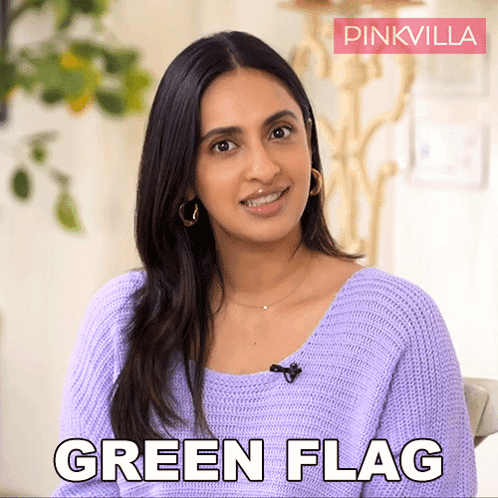 Woman Smiling and Saying Green Flag