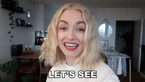 Woman Smiling And Saying Lets See GIF