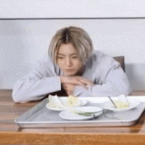 Woman Smiling at Camera Man in Kitchen