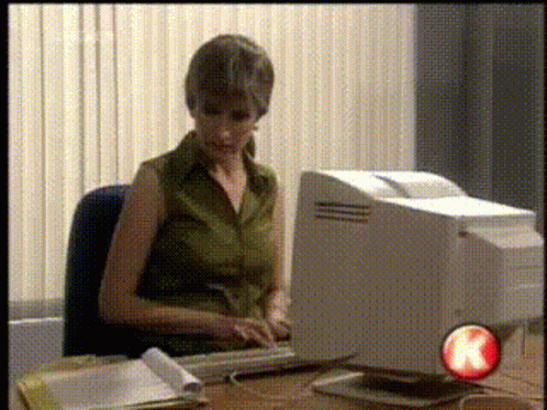 Woman Smiling at Laptop With gsh Sticker