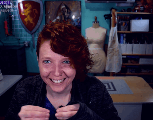 Woman Smiling At Shield Saying UB X79 GIF