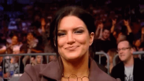 Woman Smiling at Wrestling Event