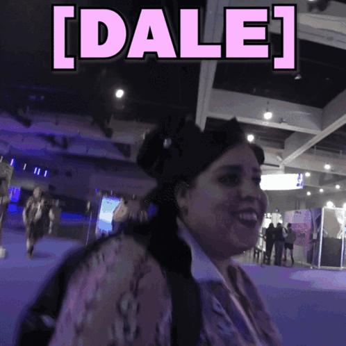 Woman Smiling Beside Sign Saying Dale