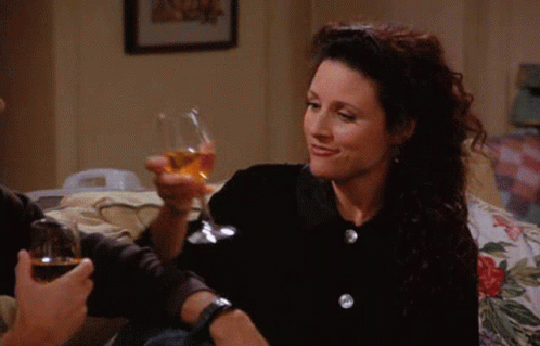 Woman Smiling Holding Glass Of Wine GIF