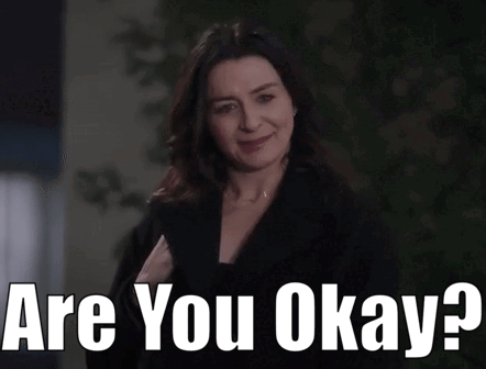 Woman Smiling Holding Paper Saying Are You Okay GIF