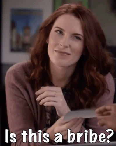 Woman Smiling Holding Paper Saying Is This a Bribe